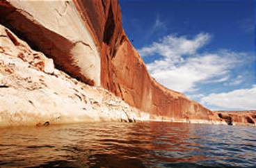 Colorful Tapestry Wall shows signs of white where recent water levels were at Lake Powell. (Ravell Call, Deseret Morning News)